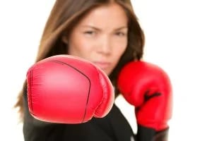 bigstock-Boxing-business-woman-punching-22601561-300x200