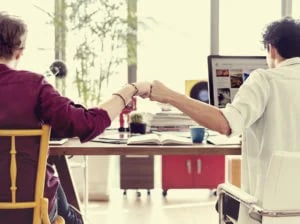 bigstock-Fist-Bump-Colleagues-Collabora-138988097-300x224