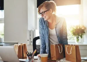 bigstock-Happy-Businesswoman-Working-In-99245798-300x217